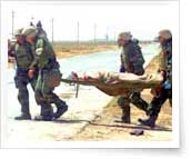 soldier carried on stretcher