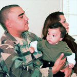 Soldier holding a baby